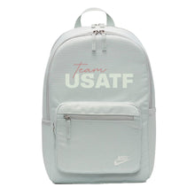 A gray Nike Sportswear Heritage backpack with the text 'team USATF' printed on the front pocket.