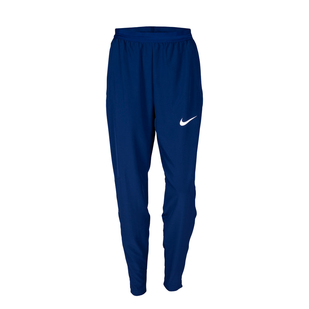 Nike Team USA Women's Woven Pants in blue color with a tapered leg design and a visible Nike logo on the left thigh.