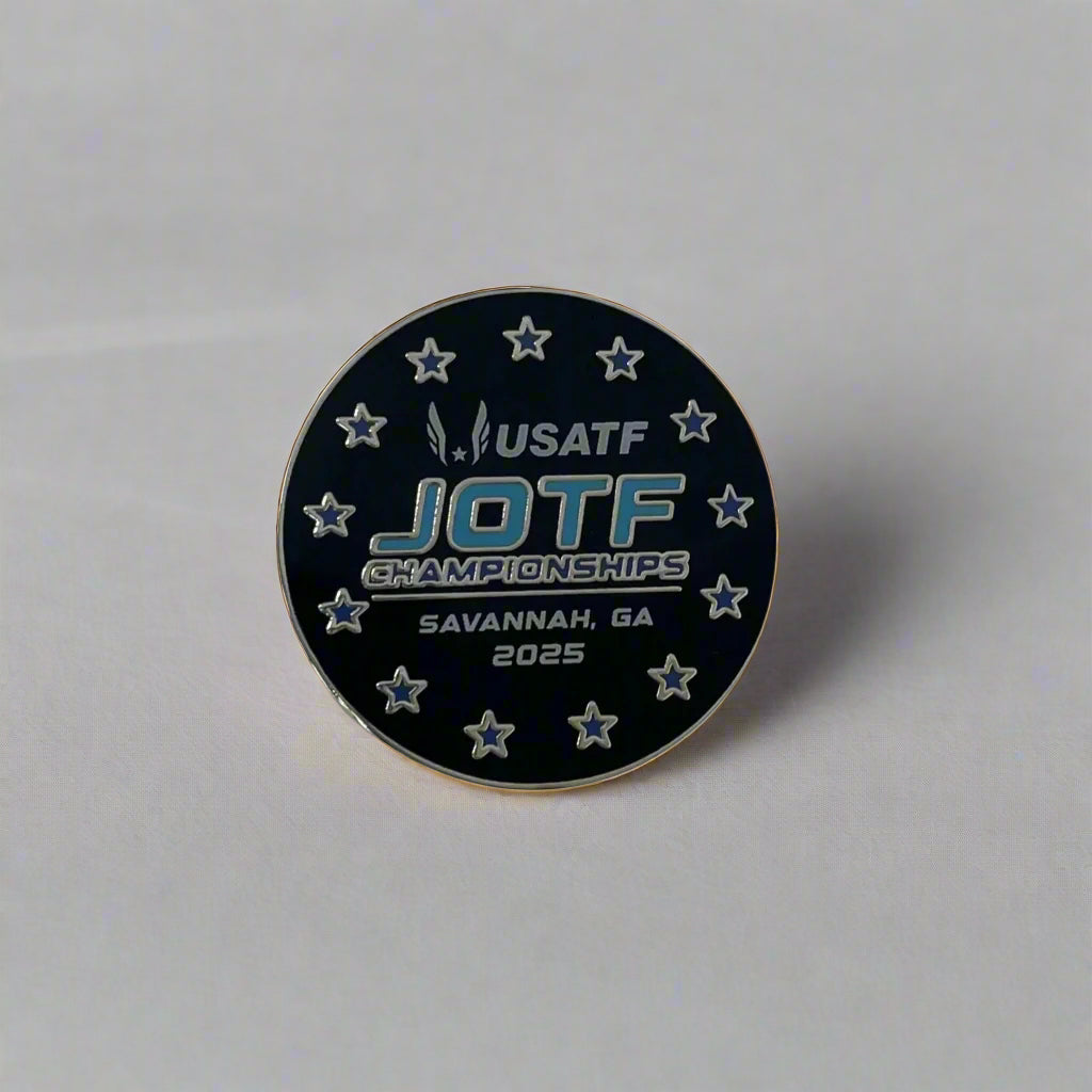 Black and silver round lapel pin with 2025 USATF JOTF Championships